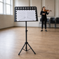 Tempo Gear music stand in a rehearsal studio with sheet music